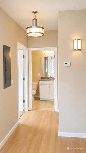 South Burlington apartment for rent - A hallway with a light brown wooden floor and white walls.
