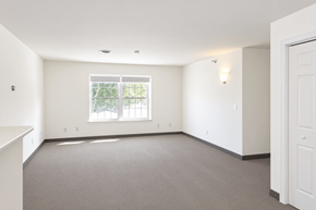 South Burlington apartment for rent - A room with a window and a carpeted floor.