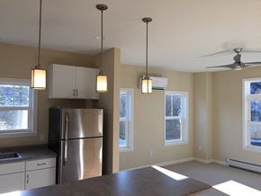 South Burlington apartment for rent - Hayes Kitchen facing living room with overhead light fixtures and four exterior windows