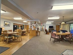 Burlington apartment for rent - McKenzie House community room with tables, television and comfy chairs