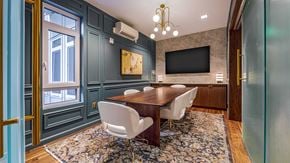 Bellevue apartment for rent - A dining room with a wooden table and chairs.
