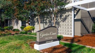 Alameda apartment for rent - A sign for Garden Court with a phone number on it.