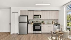 Seattle apartment for rent - A modern kitchen with a dining table and chairs.