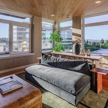 Bellevue apartment for rent - A modern living room with a grey sofa and a wooden coffee table.