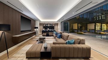 Los Angeles apartment for rent - a large living room with a large couch and a television