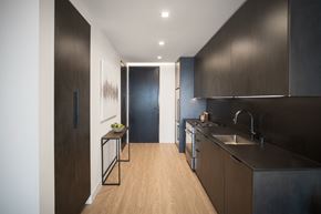 Los Angeles apartment for rent - Dark kitchen cabinets and quartz counters,
