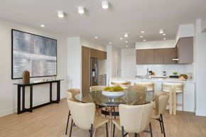 Los Angeles apartment for rent - A modern dining room with a glass table and chairs.