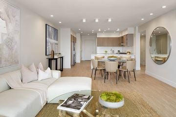 Los Angeles apartment for rent - A modern living room with a glass coffee table and a white sofa.