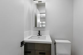 Los Angeles apartment for rent - a bathroom with a sink and a mirror and a toilet