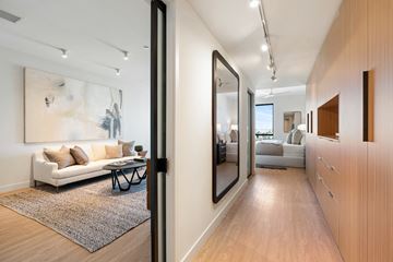 Los Angeles apartment for rent - A modern living room with a white couch and a large abstract painting on the wall.
