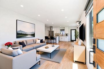 Los Angeles apartment for rent - A modern living room with a grey sofa and a coffee table.