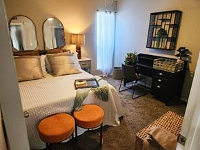 Stillwater apartment for rent - A bedroom with a bed, desk, and chair.