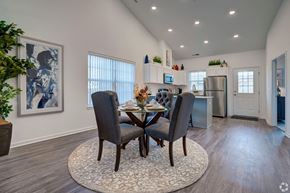 Howell apartment for rent - A dining room with a table set for two and a plant on the side table.