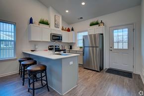 Howell apartment for rent - A kitchen with a white counter and stainless steel appliances.