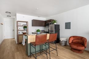 Centralia apartment for rent - A kitchen with a table and chairs in the middle of the room.