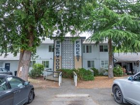 Lakewood apartment for rent - A white building with a sign that says Big Forest Shedwood.