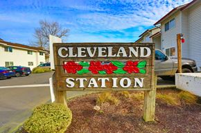 Gresham apartment for rent - A sign that says Cleveland Station with flowers on it.