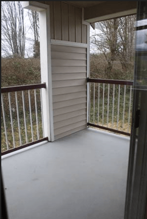 Sedro Woolley apartment for rent - a screened in porch with a view of a yard and trees
