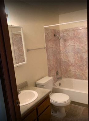 Kirkland apartment for rent - a bathroom with a toilet and a sink and a shower