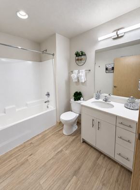 Wenatchee apartment for rent - A white bathroom with a toilet, sink, and bathtub.
