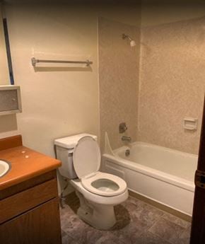 Kirkland apartment for rent - a bathroom with a toilet and a tub and a sink