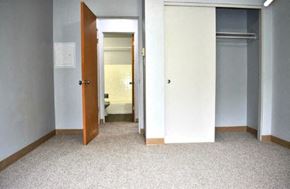 Seattle apartment for rent - an empty room with an open door to a bathroom