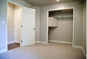 Seattle apartment for rent - A white door is open to a room with a closet.