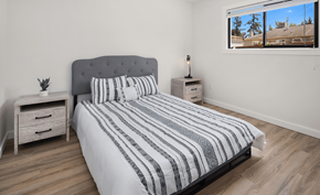Anacortes apartment for rent - a bedroom with a bed and a window