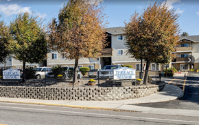 East Wenatchee apartment for rent - a yard with signs in front of an apartment building