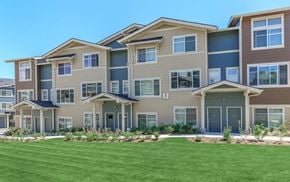 Snoqualmie townhouse for rent - A large, modern apartment building with multiple balconies and doors.