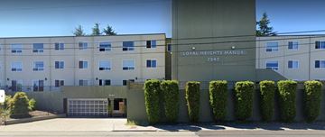 Seattle apartment for rent - a large building with a street in front of it