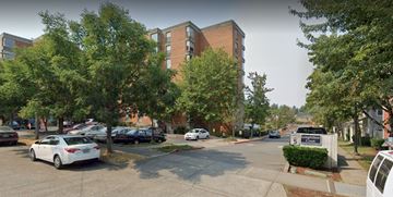 Seattle apartment for rent - an image of a street with cars and a building