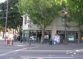 Seattle apartment for rent - a building on the corner of a street with trees