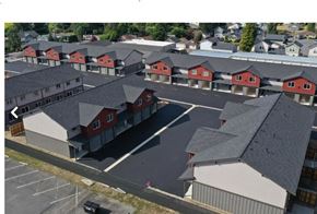 Sedro Woolley apartment for rent - an aerial view of a neighborhood of houses with red and gray roofs