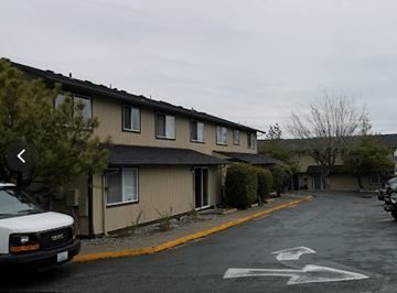 Anacortes apartment for rent - an empty parking lot in front of an apartment building