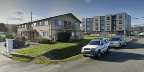 Anacortes apartment for rent - a group of cars parked in front of an apartment building