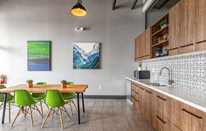 Everett apartment for rent - a kitchen and dining area with a table and chairs and a sink