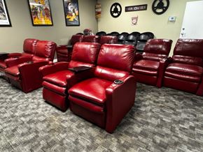 Everett apartment for rent - A row of red leather chairs are lined up in a room.