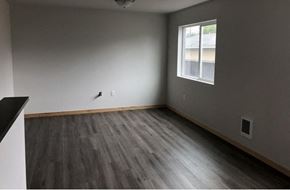 Sedro Woolley apartment for rent - an empty room with wooden floors and a window