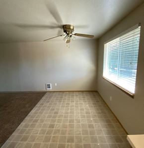 Marysville apartment for rent - a living room with a ceiling fan and a window