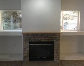Lynnwood apartment for rent - a living room with a brick fireplace and two windows