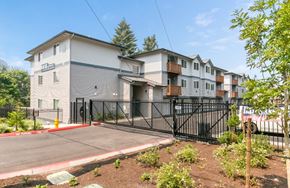 Seattle apartment for rent - A building with a black gate in front of it.