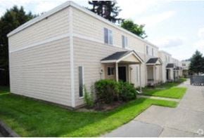 Kirkland apartment for rent - a row of white mobile homes on a street