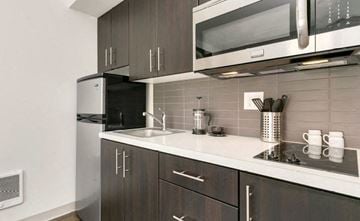 Seattle apartment for rent - a kitchen with a sink and a microwave