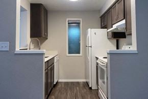 Bothell apartment for rent - a kitchen with white appliances and a refrigerator