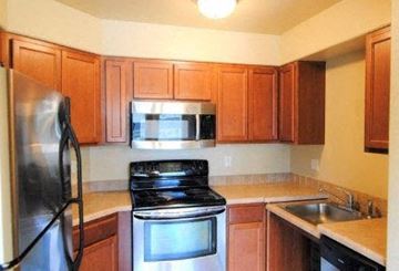 Wenatchee apartment for rent - a kitchen with a stove microwave and sink
