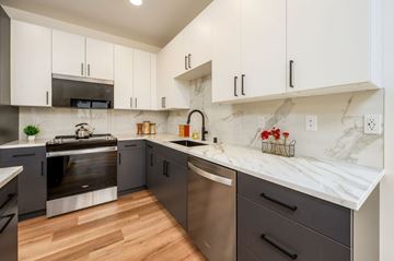 Marysville apartment for rent - A kitchen with a stainless steel dishwasher and a stove top oven.