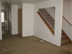 Sedro Woolley apartment for rent - an empty room with a staircase and a hallway with a door
