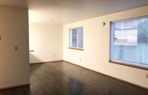 Burlington apartment for rent - A room with a window and a wooden floor.