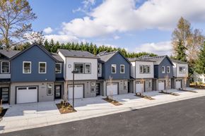 Marysville apartment for rent - A row of houses with garages in front of them.